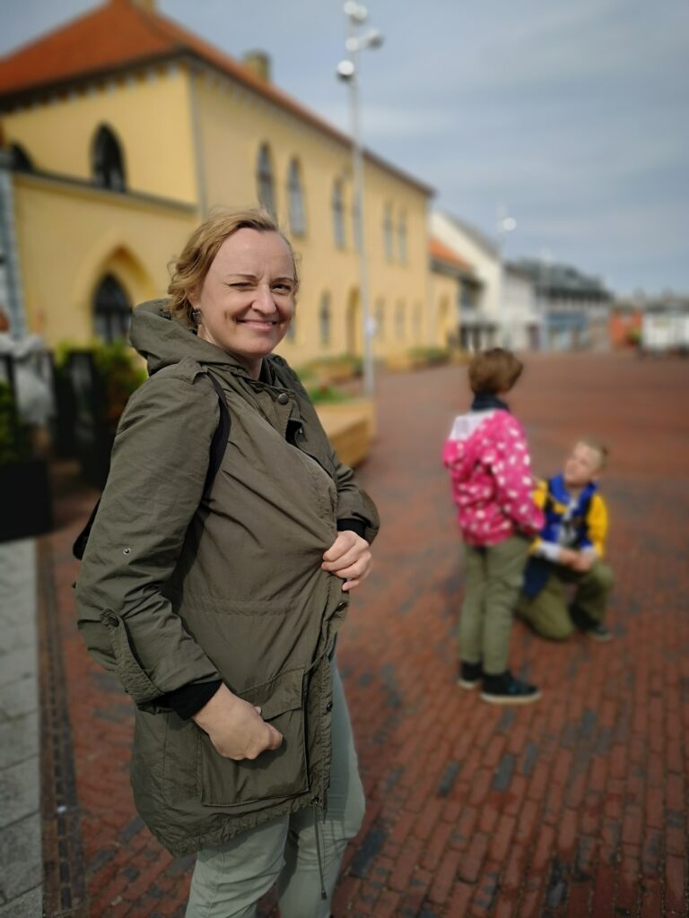 Marika Mägi with her children (in the background) in the streets of Denmark, her second homeland. Photo credit: Sirli Valton
