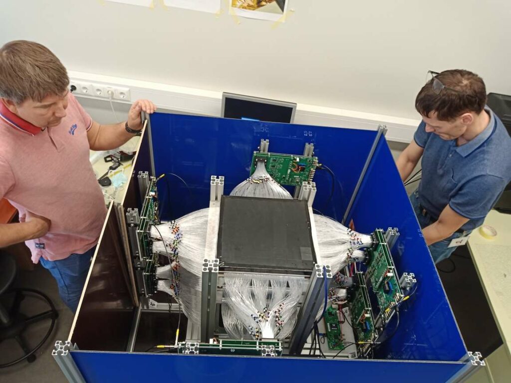 The GScan team members Tõnu Lepp and Madis Kiisk connecting the last bits and pieces of the muon tomograph. Photo credit: private collection