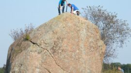 Scientists taking samples from an erratic.