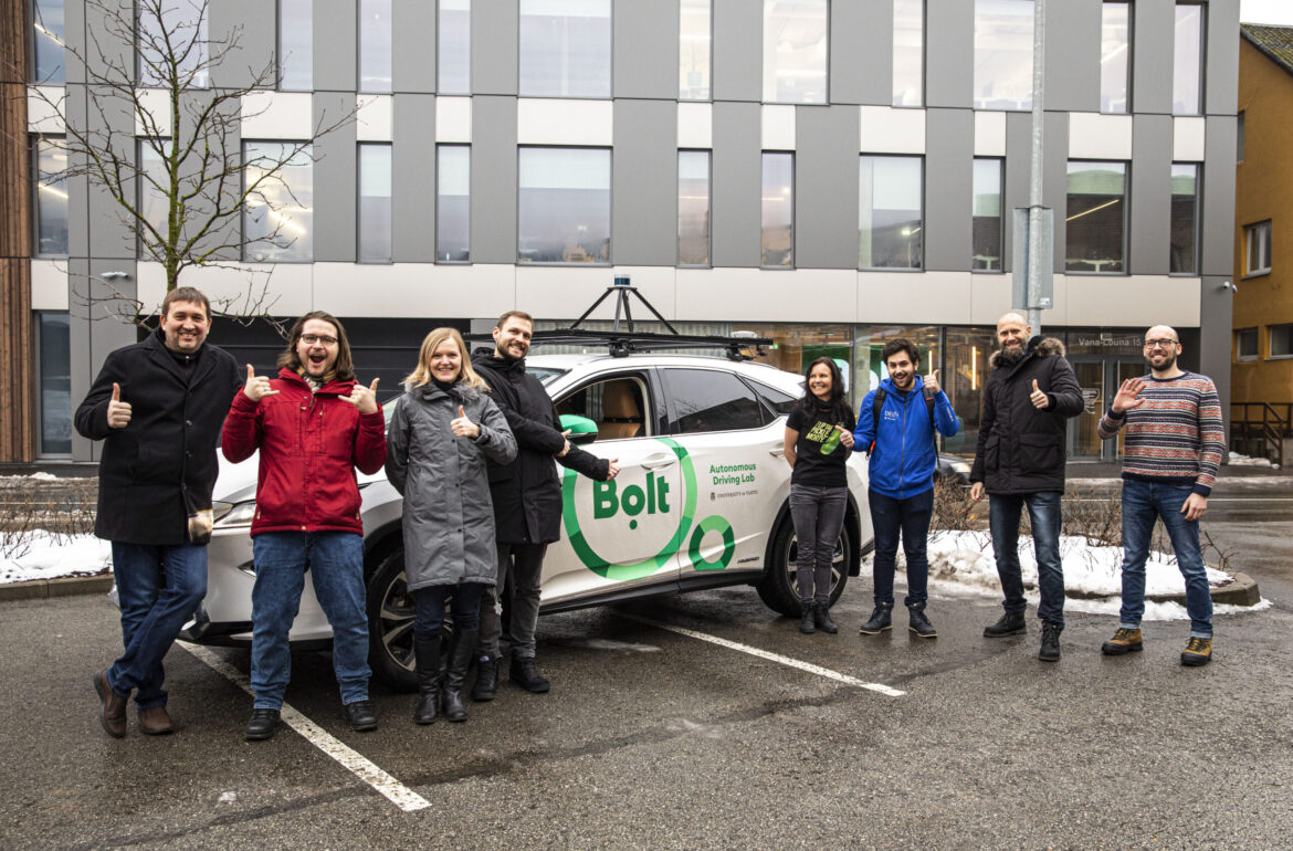 Employees of the University of Tartu Autonomous Driving Lab and Bolt representatives at the presentation of the lab’s test car running the Tallinn demo track. Photo credit: Mathis Bogens/Bolt